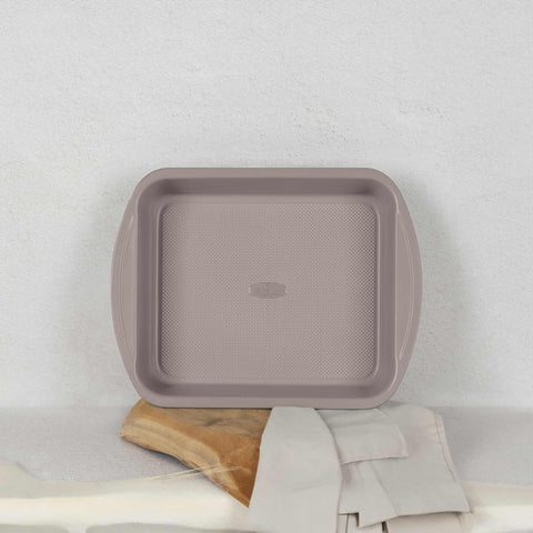 Product image of Oblong roaster 35x27cm. Part of the Taupe Collection . Features: • Material: carbon steel with titanPro non-stick coating • Size: 35*27*6,5 cm • Color: matt taupe. (Studio view). Official Berlinger Haus product, boosted by Promintra sl.