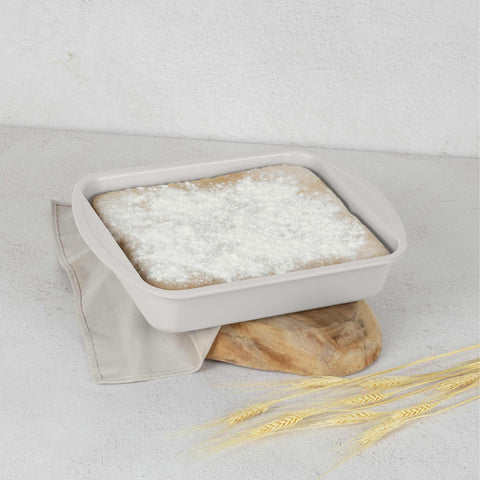Product image of Oblong roaster 35x27cm. Part of the Sahara Collection . Features: • Material: carbon steel with titanPro non-stick coating • Size: 35*27*6,5 cm • Color: matt cream. (Lifestyle view). Official Berlinger Haus product, boosted by Promintra sl.