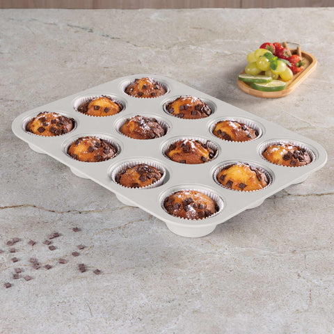 Product image of 12cups muffin pan. Part of the Sahara Collection . Features: • Material: carbon steel with titanPro non-stick coating • Size: 35*26,5*3 cm • Color: matt cream. (Studio view). Official Berlinger Haus product, boosted by Promintra sl.