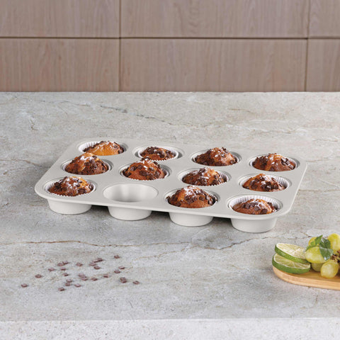Product image of 12cups muffin pan. Part of the Sahara Collection . Features: • Material: carbon steel with titanPro non-stick coating • Size: 35*26,5*3 cm • Color: matt cream. (Studio view). Official Berlinger Haus product, boosted by Promintra sl.