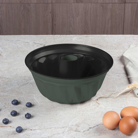 Product image of Bundt pan 25cm. Part of the Matte Green Collection . Features: • Material: carbon steel with titanPro non-stick coating • Size: 25*10,5 cm • Color: matt green. (Studio view). Official Berlinger Haus product, boosted by Promintra sl.