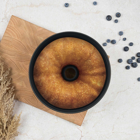 Product image of Bundt pan 25cm. Part of the Matte Green Collection . Features: • Material: carbon steel with titanPro non-stick coating • Size: 25*10,5 cm • Color: matt green. (Studio view). Official Berlinger Haus product, boosted by Promintra sl.