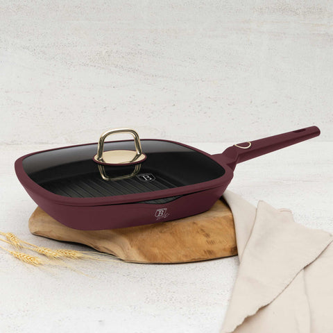 Product image of Grill pan with lid 28cm. Part of the Leonardo Collection . Features: • Material: forged aluminum with non-stick titanPro coating • Grill pan with lid Ø28*4,1 cm 2,1L • Color: matt bordeaux REGISTERED DESIGN BY BERLIN.... (Studio view). Official Berlinger Haus product, boosted by Promintra sl.