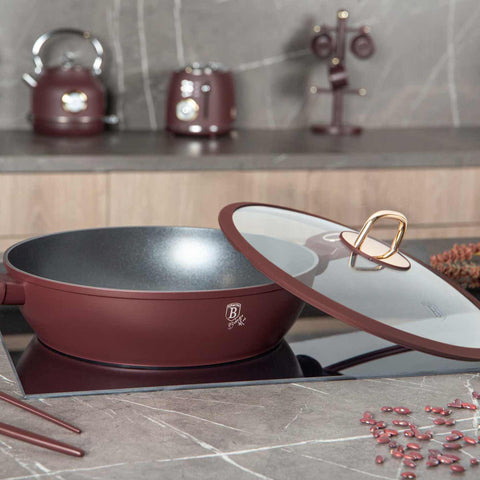 Product image of Shallow pot with lid 30cm. Part of the Leonardo Collection . Features: • Material: forged aluminum with non-stick titanPro coating • Shallow pot with lid Ø30*8 cm 4,5L • Color: matt bordeaux REGISTERED DESIGN BY BERLIN.... (Studio view). Official Berlinger Haus product, boosted by Promintra sl.