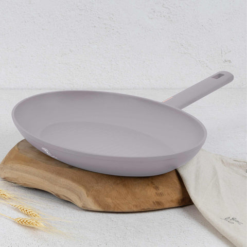 Product image of Fish pan 35x25cm. Part of the Taupe Collection . Features: • Material: forged aluminum with non-stick titanPro coating • Fish pan Ø35*25*4,5 cm • Color: matt taupe REGISTERED DESIGN BY BERLINGER HAUS!. (Studio view). Official Berlinger Haus product, boosted by Promintra sl.