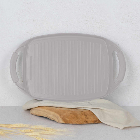 Product image of Grill plate 47cm. Part of the Taupe Collection . Features: • Material: forged aluminum with non-stick titanPro coating • Size: 47*29 cm • Color: matt taupe • FREE 2 PCS HEAT RESISTANT SILICONE HANDLE. (Studio view). Official Berlinger Haus product, boosted by Promintra sl.