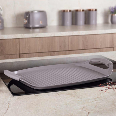 Product image of Grill plate 47cm. Part of the Taupe Collection . Features: • Material: forged aluminum with non-stick titanPro coating • Size: 47*29 cm • Color: matt taupe • FREE 2 PCS HEAT RESISTANT SILICONE HANDLE. (Studio view). Official Berlinger Haus product, boosted by Promintra sl.