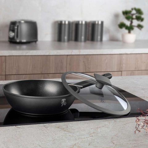 Product image of Deep frypan with lid 24cm. Part of the Anthracite Collection . Features: • Material: forged aluminum with non-stick titanPro coating • Deep frypan with lid Ø24*6,5 cm 2,3L • Color: matt anthracite REGISTERED DESIGN BY BE.... (Studio view). Official Berlinger Haus product, boosted by Promintra sl.