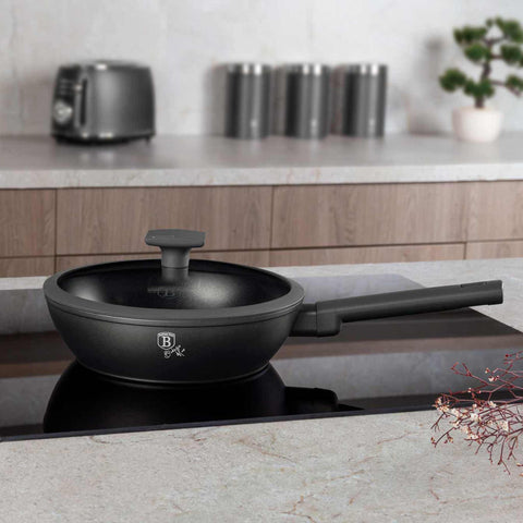 Product image of Deep frypan with lid 24cm. Part of the Anthracite Collection . Features: • Material: forged aluminum with non-stick titanPro coating • Deep frypan with lid Ø24*6,5 cm 2,3L • Color: matt anthracite REGISTERED DESIGN BY BE.... (Studio view). Official Berlinger Haus product, boosted by Promintra sl.