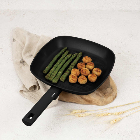 Product image of Grill pan 28cm. Part of the Matte Black Collection . Features: • Material: forged aluminum with non-stick titanPro coating • Grill pan Ø28*4,1 cm 2,1L • Color: black- silver REGISTERED DESIGN BY BERLINGER HAUS!. (Studio view). Official Berlinger Haus product, boosted by Promintra sl.