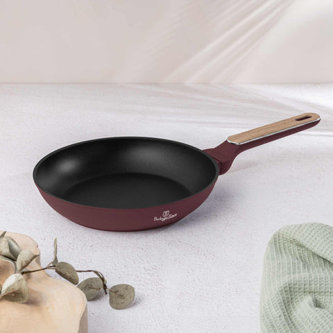 Product image of Frypan 24cm. Part of the Leonardo Nordic Collection . Features: • Material: forged aluminum with non-stick titanPro coating • Frypan Ø24*4,8 cm 1,7L • Color: matt bordeaux, wooden REGISTERED DESIGN BY BERLINGER .... (Studio view). Official Berlinger Haus product, boosted by Promintra sl.