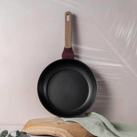 Product image of Frypan 24cm. Part of the Leonardo Nordic Collection . Features: • Material: forged aluminum with non-stick titanPro coating • Frypan Ø24*4,8 cm 1,7L • Color: matt bordeaux, wooden REGISTERED DESIGN BY BERLINGER .... (Studio view). Official Berlinger Haus product, boosted by Promintra sl.