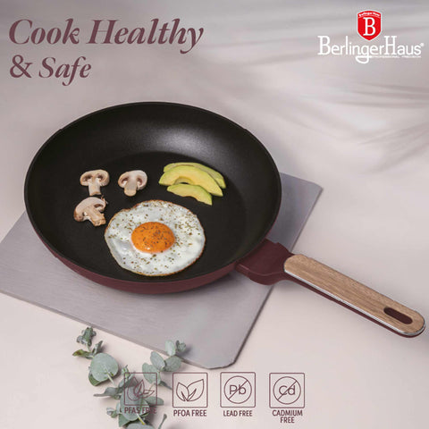 Product image of Frypan 28cm. Part of the Leonardo Nordic Collection . Features: • Material: forged aluminum with non-stick titanPro coating • Frypan Ø28*5,2 cm 2,4L • Color: matt bordeaux, wooden REGISTERED DESIGN BY BERLINGER .... (Studio view). Official Berlinger Haus product, boosted by Promintra sl.