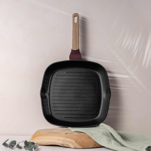 Product image of Grill pan 28cm. Part of the Leonardo Nordic Collection . Features: • Material: forged aluminum with non-stick titanPro coating • Grill pan Ø28*4,1 cm 2,1L • Color: matt bordeaux, wooden REGISTERED DESIGN BY BERLING.... (Studio view). Official Berlinger Haus product, boosted by Promintra sl.