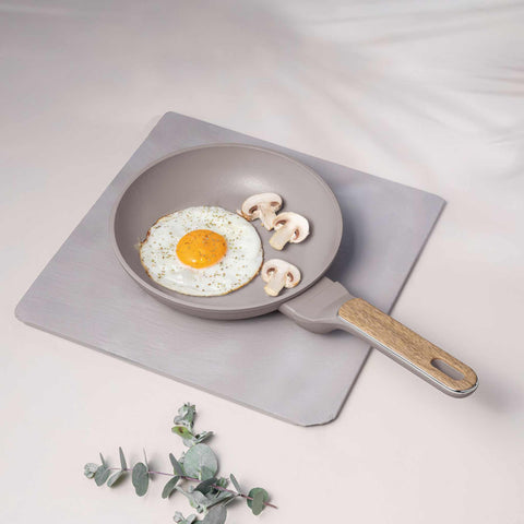 Product image of Frypan 20cm. Part of the Taupe Nordic Collection . Features: • Material: forged aluminum with non-stick titanPro coating • Frypan Ø20*4,5 cm 1,0L • Color: matt taupe, wooden REGISTERED DESIGN BY BERLINGER HAUS!. (Studio view). Official Berlinger Haus product, boosted by Promintra sl.