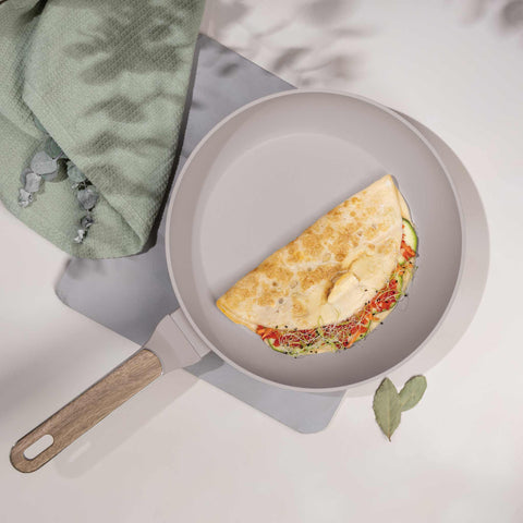 Product image of Frypan 28cm. Part of the Taupe Nordic Collection . Features: • Material: forged aluminum with non-stick titanPro coating • Frypan Ø28*5,2 cm 2,4L • Color: matt taupe, wooden REGISTERED DESIGN BY BERLINGER HAUS!. (Studio view). Official Berlinger Haus product, boosted by Promintra sl.