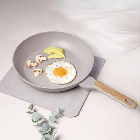 Product image of Frypan 28cm. Part of the Taupe Nordic Collection . Features: • Material: forged aluminum with non-stick titanPro coating • Frypan Ø28*5,2 cm 2,4L • Color: matt taupe, wooden REGISTERED DESIGN BY BERLINGER HAUS!. (Studio view). Official Berlinger Haus product, boosted by Promintra sl.