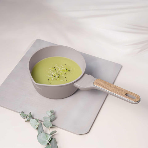 Product image of Sauce pan 16cm. Part of the Taupe Nordic Collection . Features: • Material: forged aluminum with non-stick titanPro coating • Sauce pan Ø16*7,5 cm 1,2L • Color: matt taupe, wooden REGISTERED DESIGN BY BERLINGER .... (Studio view). Official Berlinger Haus product, boosted by Promintra sl.