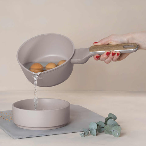 Product image of Sauce pan 16cm. Part of the Taupe Nordic Collection . Features: • Material: forged aluminum with non-stick titanPro coating • Sauce pan Ø16*7,5 cm 1,2L • Color: matt taupe, wooden REGISTERED DESIGN BY BERLINGER .... (Studio view). Official Berlinger Haus product, boosted by Promintra sl.