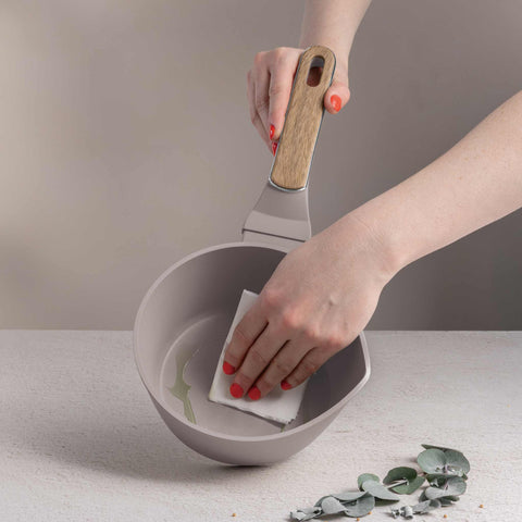 Product image of Sauce pan 16cm. Part of the Taupe Nordic Collection . Features: • Material: forged aluminum with non-stick titanPro coating • Sauce pan Ø16*7,5 cm 1,2L • Color: matt taupe, wooden REGISTERED DESIGN BY BERLINGER .... (Studio view). Official Berlinger Haus product, boosted by Promintra sl.