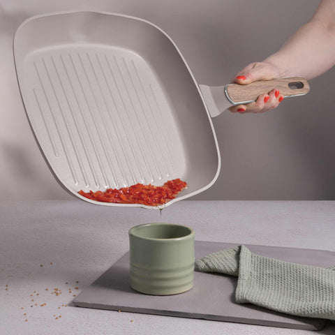 Product image of Grill pan with lid 28cm. Part of the Taupe Nordic Collection . Features: • Material: forged aluminum with non-stick titanPro coating • Grill pan with lid Ø28*4,1 cm 2,1L • Color: matt taupe, wooden REGISTERED DESIGN BY B.... (Studio view). Official Berlinger Haus product, boosted by Promintra sl.