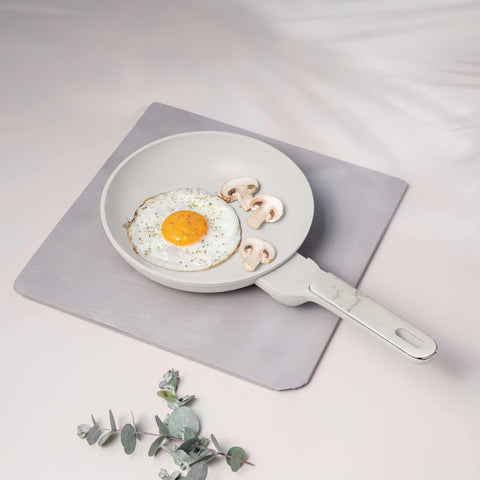 Product image of Frypan 20cm. Part of the Sahara Marble Collection . Features: • Material: forged aluminum with non-stick titanPro coating • Frypan Ø20*4,5 cm 1,0L • Color: matt cream, marble REGISTERED DESIGN BY BERLINGER HAUS!. (Studio view). Official Berlinger Haus product, boosted by Promintra sl.