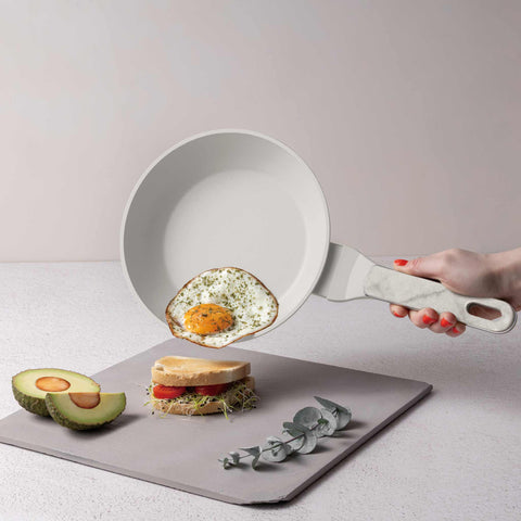 Product image of Frypan 20cm. Part of the Sahara Marble Collection . Features: • Material: forged aluminum with non-stick titanPro coating • Frypan Ø20*4,5 cm 1,0L • Color: matt cream, marble REGISTERED DESIGN BY BERLINGER HAUS!. (Studio view). Official Berlinger Haus product, boosted by Promintra sl.