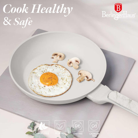Product image of Frypan 24cm. Part of the Sahara Marble Collection . Features: • Material: forged aluminum with non-stick titanPro coating • Frypan Ø24*4,8 cm 1,7L • Color: matt cream, marble REGISTERED DESIGN BY BERLINGER HAUS!. (Studio view). Official Berlinger Haus product, boosted by Promintra sl.