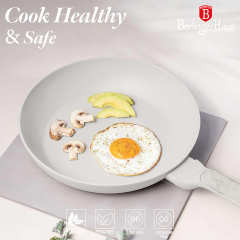 Product image of Frypan 28cm. Part of the Sahara Marble Collection . Features: • Material: forged aluminum with non-stick titanPro coating • Frypan Ø28*5,2 cm 2,4L • Color: matt cream, marble REGISTERED DESIGN BY BERLINGER HAUS!. (Studio view). Official Berlinger Haus product, boosted by Promintra sl.