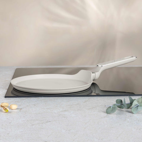 Product image of Pancake pan 25cm. Part of the Sahara Marble Collection . Features: • Material: forged aluminum with non-stick titanPro coating • Pancake pan Ø25*2,2 cm • Color: matt cream, marble REGISTERED DESIGN BY BERLINGER HAUS!. (Studio view). Official Berlinger Haus product, boosted by Promintra sl.