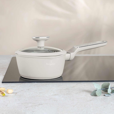 Product image of Sauce pan with lid 16cm. Part of the Sahara Marble Collection . Features: • Material: forged aluminum with non-stick titanPro coating • Sauce pan Ø16*7,5 cm 1,2L • Color: matt cream, marble REGISTERED DESIGN BY BERLINGER .... (Studio view). Official Berlinger Haus product, boosted by Promintra sl.