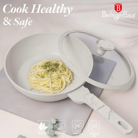 Product image of Deep frypan with lid 24cm. Part of the Sahara Marble Collection . Features: • Material: forged aluminum with non-stick titanPro coating • Deep frypan with lid Ø24*6,5 cm 2,3L • Color: matt cream, marble REGISTERED DESIGN BY.... (Studio view). Official Berlinger Haus product, boosted by Promintra sl.