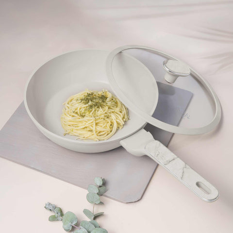 Product image of Deep frypan with lid 24cm. Part of the Sahara Marble Collection . Features: • Material: forged aluminum with non-stick titanPro coating • Deep frypan with lid Ø24*6,5 cm 2,3L • Color: matt cream, marble REGISTERED DESIGN BY.... (Studio view). Official Berlinger Haus product, boosted by Promintra sl.