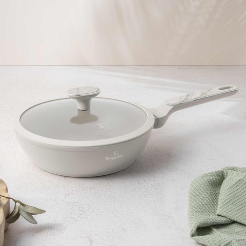 Product image of Deep frypan with lid 24cm. Part of the Sahara Marble Collection . Features: • Material: forged aluminum with non-stick titanPro coating • Deep frypan with lid Ø24*6,5 cm 2,3L • Color: matt cream, marble REGISTERED DESIGN BY.... (Studio view). Official Berlinger Haus product, boosted by Promintra sl.