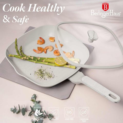 Product image of Grill pan with lid 28cm. Part of the Sahara Marble Collection . Features: • Material: forged aluminum with non-stick titanPro coating • Grill pan with lid Ø28*4,1 cm 2,1L • Color: matt cream, marble REGISTERED DESIGN BY B.... (Studio view). Official Berlinger Haus product, boosted by Promintra sl.