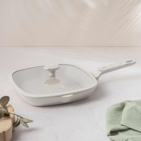 Product image of Grill pan with lid 28cm. Part of the Sahara Marble Collection . Features: • Material: forged aluminum with non-stick titanPro coating • Grill pan with lid Ø28*4,1 cm 2,1L • Color: matt cream, marble REGISTERED DESIGN BY B.... (Studio view). Official Berlinger Haus product, boosted by Promintra sl.