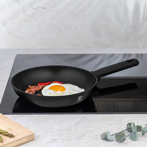 Product image of Frypan 24cm. Part of the Matte Black Collection . Features: • Material: forged aluminum with non-stick titanPro coating • Frypan Ø24*4,8 cm 1,7L • Color: black- silver. (Studio view). Official Berlinger Haus product, boosted by Promintra sl.