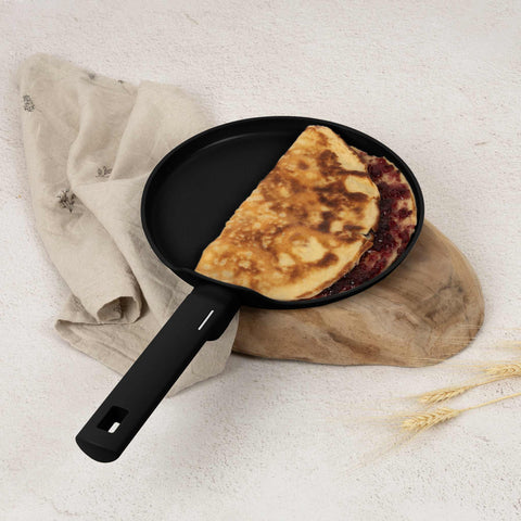 Product image of Pancake pan 25cm. Part of the Matte Black Collection . Features: • Material: forged aluminum with non-stick titanPro coating • Pancake pan Ø25*2,2 cm • Color: black- silver. (Studio view). Official Berlinger Haus product, boosted by Promintra sl.