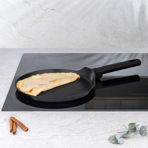 Product image of Pancake pan 25cm. Part of the Matte Black Collection . Features: • Material: forged aluminum with non-stick titanPro coating • Pancake pan Ø25*2,2 cm • Color: black- silver. (Studio view). Official Berlinger Haus product, boosted by Promintra sl.