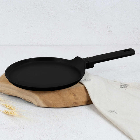 Product image of Pancake pan 25cm. Part of the Matte Black Collection . Features: • Material: forged aluminum with non-stick titanPro coating • Pancake pan Ø25*2,2 cm • Color: black- silver. (Studio view). Official Berlinger Haus product, boosted by Promintra sl.