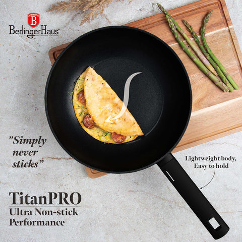 Product image of Wok 28cm. Part of the Matte Black Collection . Features: • Material: forged aluminum with non-stick titanPro coating • Wok Ø28*7,8 cm 3,1L • Color: black- silver. (Studio view). Official Berlinger Haus product, boosted by Promintra sl.