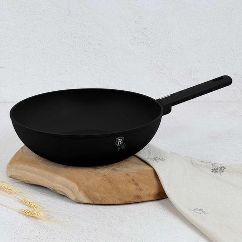Product image of Wok 28cm. Part of the Matte Black Collection . Features: • Material: forged aluminum with non-stick titanPro coating • Wok Ø28*7,8 cm 3,1L • Color: black- silver. (Studio view). Official Berlinger Haus product, boosted by Promintra sl.