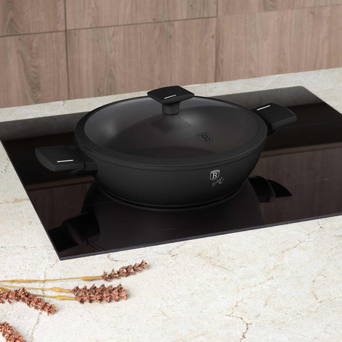 Product image of Shallow pot with lid 28cm. Part of the Matte Black Collection . Features: • Material: forged aluminum with non-stick titanPro coating • Shallow pot with lid Ø28*7,5 cm 3,8L • Color: black- silver. (Studio view). Official Berlinger Haus product, boosted by Promintra sl.