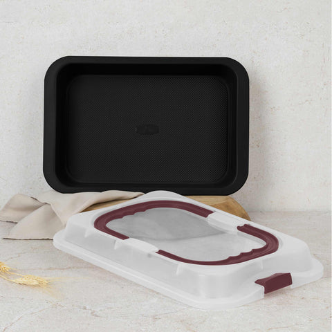 Product image of Oblong roaster with lid. Part of the Leonardo Collection . Features: • Material: carbon steel with titanPro non-stick coating, plastic cover • Size: 36,5*24,5*5,5 cm • Color: matt bordeaux. (Studio view). Official Berlinger Haus product, boosted by Promintra sl.