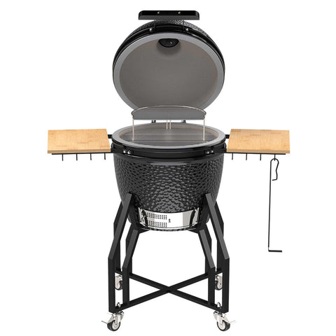 Product image of Kamado grill with high stand and side shelves. Part of the outdoor . Features: • Material: ceramic, stainless steel, bamboo • Thermometer in the top (lid) • Accessories, features: • Sectional firebox • Heat deflector • Plate s.... (Studio view). Official Berlinger Haus product, boosted by Promintra sl.