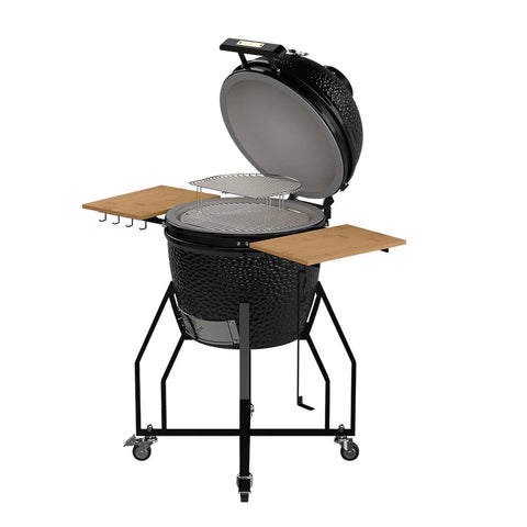 Product image of Kamado grill with high stand and side shelves. Part of the outdoor . Features: • Material: ceramic, stainless steel, bamboo • Thermometer in the top (lid) • Accessories, features: • Sectional firebox • Heat deflector • Plate s.... (Studio view). Official Berlinger Haus product, boosted by Promintra sl.