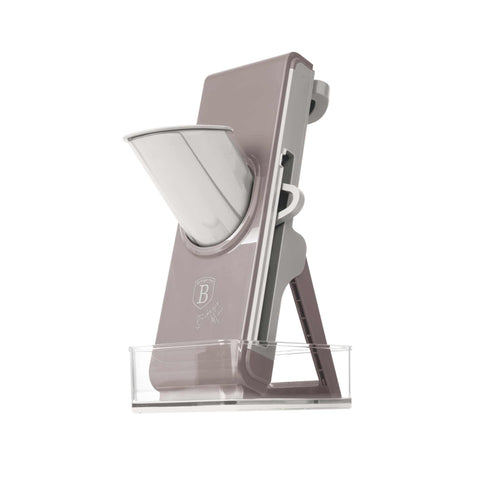 Product image of Vegetable slicer. Part of the Taupe Collection/Sahara Collection . Features: • Material: stainless steel, plastic • Size: 28,3*9,4*12,5 cm • With 3 different blades • With storage tray • Color: cream- taupe. (Studio view). Official Berlinger Haus product, boosted by Promintra sl.