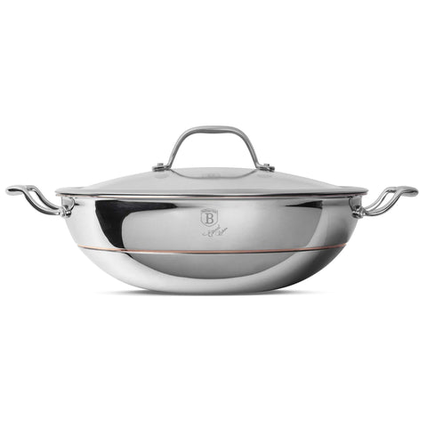 Product image of Wok with lid 28cm. Part of the Copper Touch Collection . Features: • Material: stainless steel, aluminium, copper • Size: 28*9 cm • Color: stainless steel with copper line. (Studio view). Official Berlinger Haus product, boosted by Promintra sl.