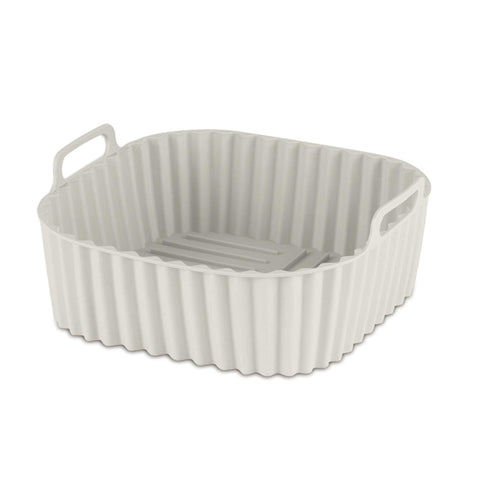 Product image of Silicone air fryer basket. Part of the Sahara Collection . Features: • Air fryer basket • Material: silicone • Size: 21*21*9 cm • Color: cream. (Studio view). Official Berlinger Haus product, boosted by Promintra sl.