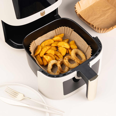 Product image of Air fryer disposable paper 20cm 50pcs. Part of the kitchen accessories . Features: • Air fryer disposable paper • Material: parchment paper • Size: 20*20*4,5 cm • Include: • 50 pcs. (Lifestyle view). Official Berlinger Haus product, boosted by Promintra sl.
